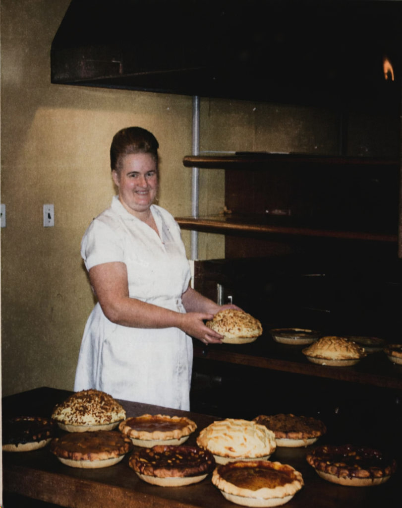 Doris Daniel making her homemade pies, 1963 (colorized family photograph).
